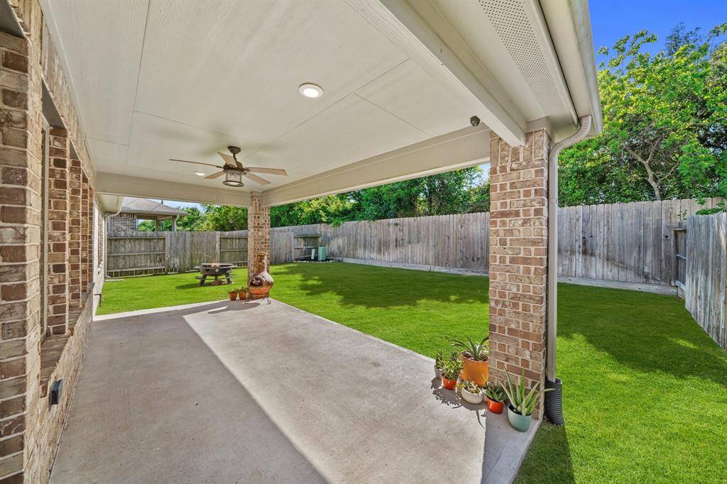 The nicely covered patio significantly enhances outdoor living in this home by providing shelter from sun and rain, allowing year-round enjoyment!