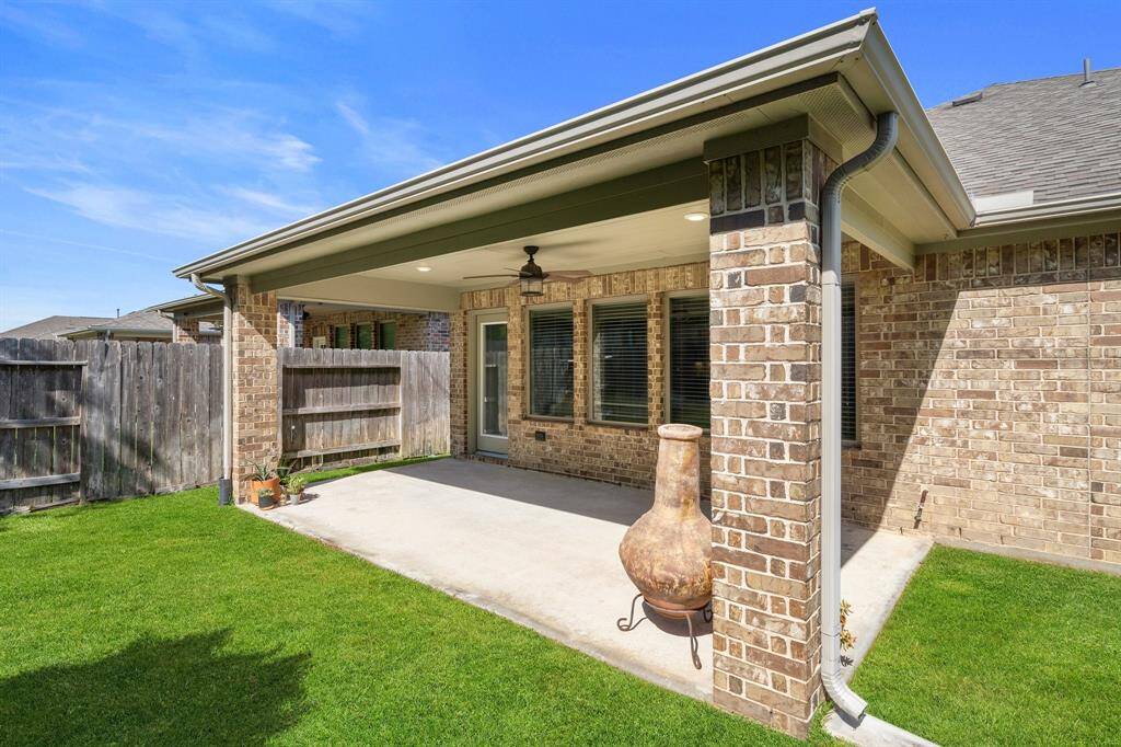 The entire exterior is finished with elegant all-back brick, enhancing both durability and curb appeal.