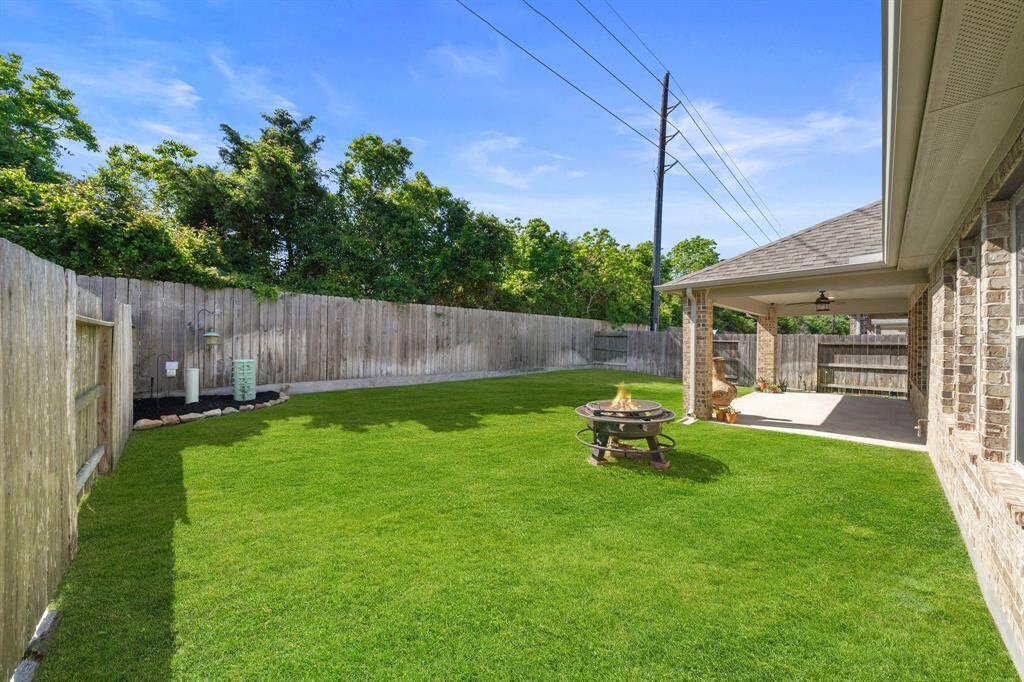 The Patio features a well-maintained sprinkler system that keeps the lush sod yard vibrant and healthy.