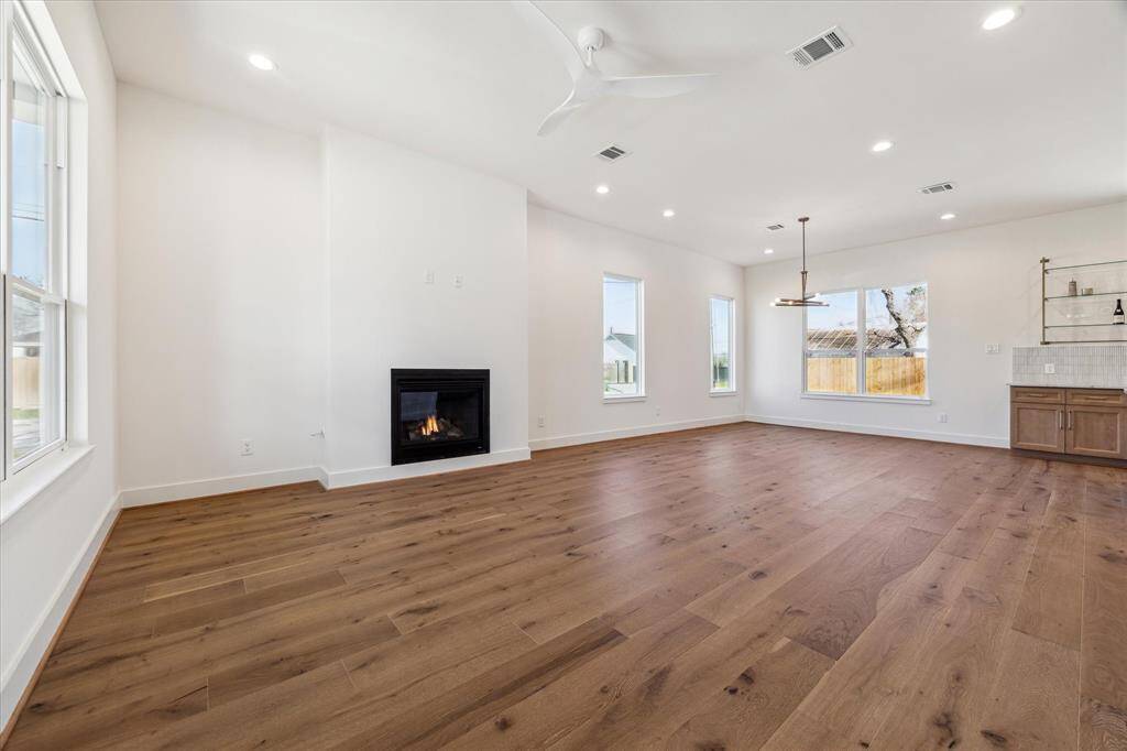 Spacious living room with cozy gas fireplace for all to enjoy.