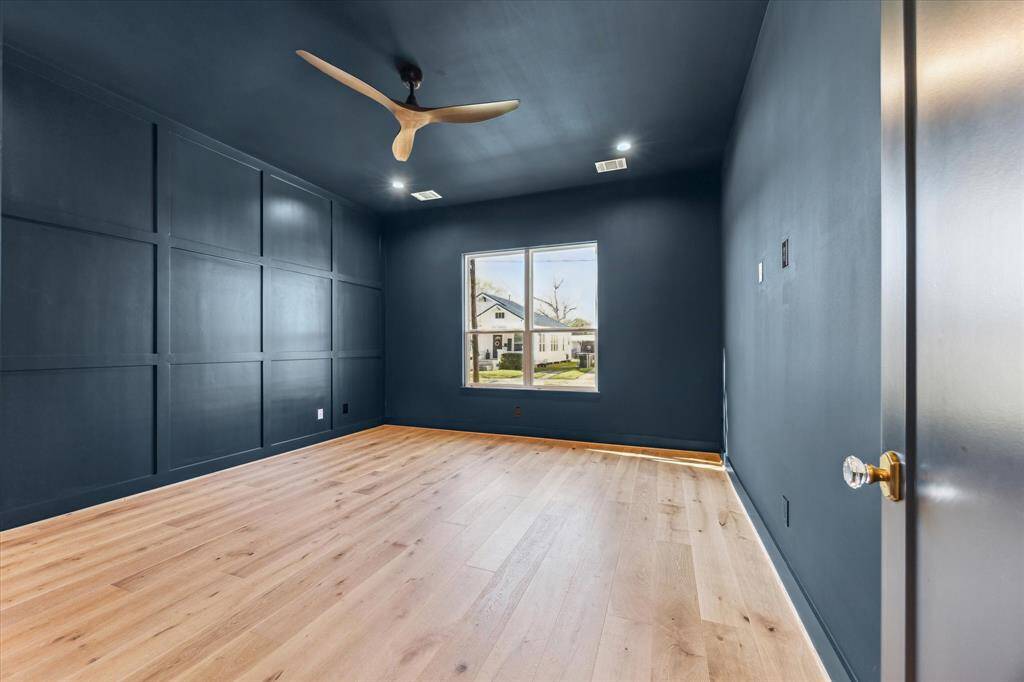 This first floor color drenched room can be used as an office or bedroom.