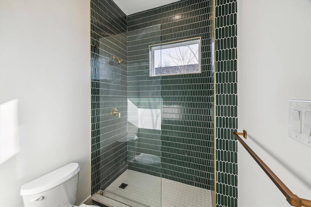 Guest bathroom features a stunning shower for all to admire.