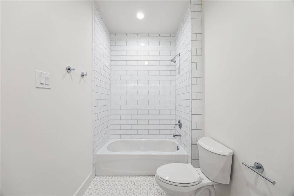 Jack & Jil bath/tub combo and creative cube tile floor.