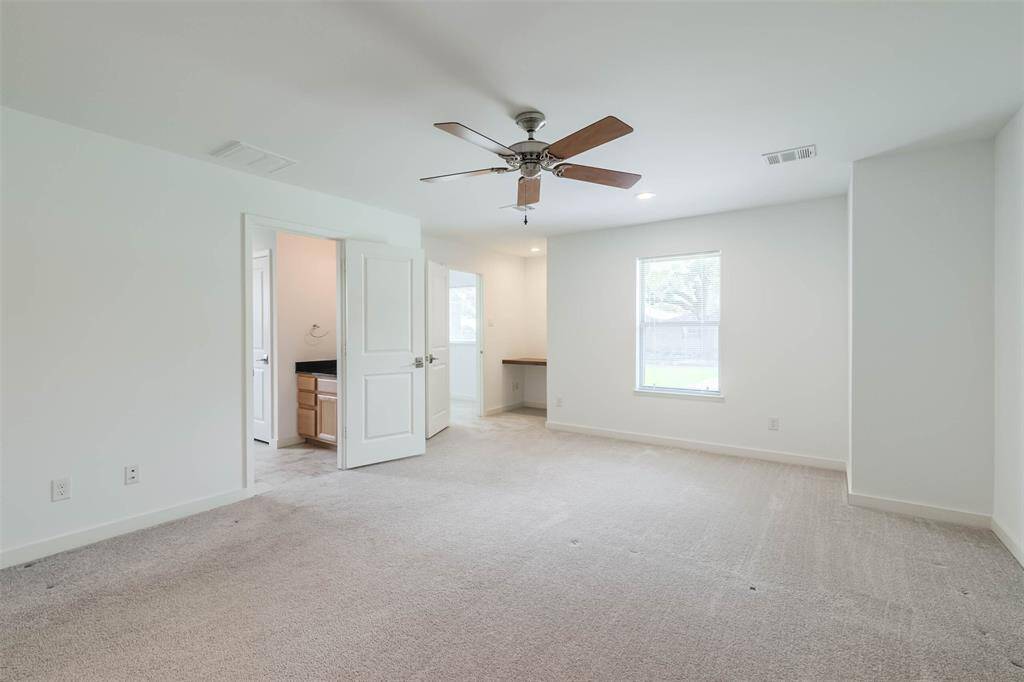 Both the primary bathroom and the large walk-in closet have windows that let the natural light in.
