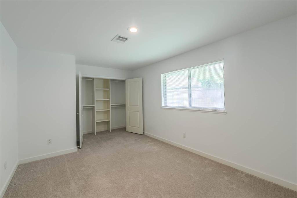 Secondary Bedroom #3 off the family room has a double doors closet and end private access to full bath #3