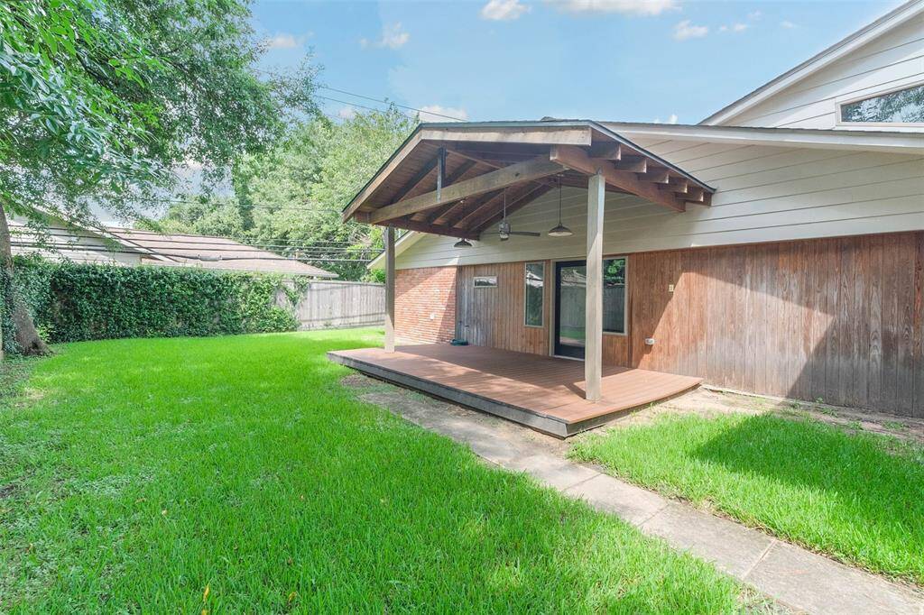 Backyard has lots of room for activities, and the lawn wraps around the back of the house.
