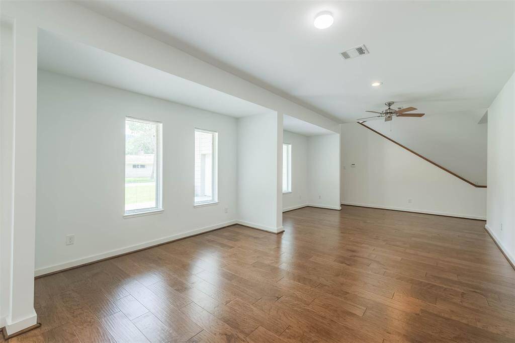 Formal dining and formal living (or study) combination with a lot of natural light.  Stairs lead to the second floor gameroom that could be transformed into a 5th bedroom.  Large storage closet under the stairs and access to the garage to the left of the closet