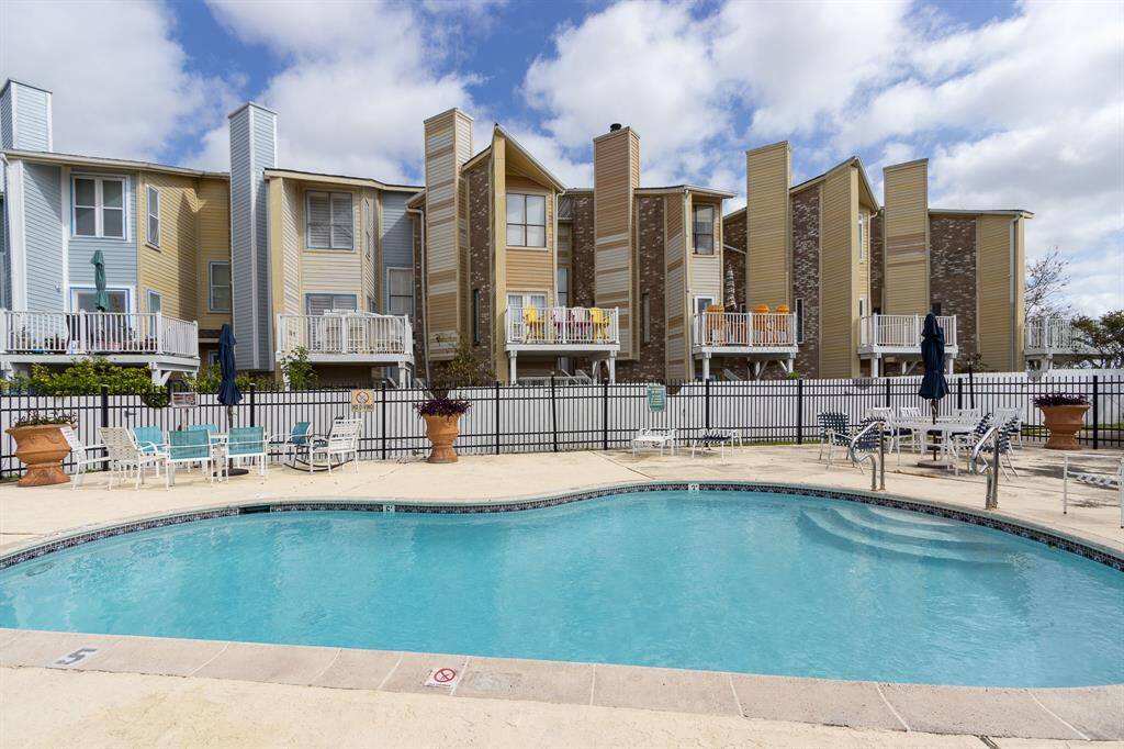 Seawall East Townhouses. The HOA is in the process of redoing the exterior of the building. Pool in the foreground!