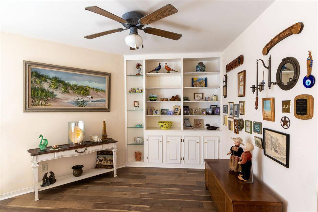 Looking through the home office/study with built-in bookcases in the background.