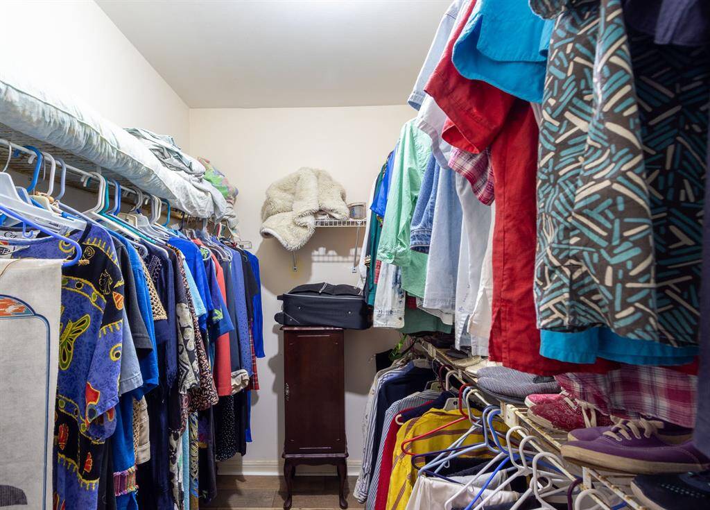 Large walk-in closet for the primary bedroom suite.