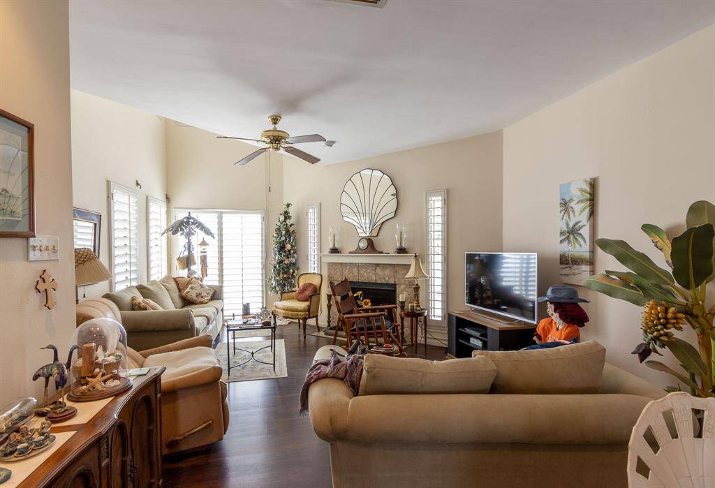 The windows have plantation shutters and the patio door in the background goes to a deck overlooking the pool and, in the distance, the Gulf of Mexico.