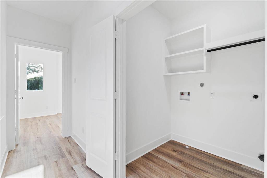 Inside the primary suite, the walk-in closet offers plenty of space and comes equipped with extra shelving & hanging rods to keep everything in its place :)