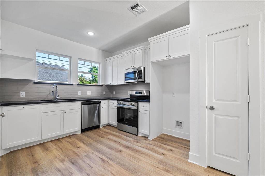 Enjoy meals in your spacious dining area with convenient access to the kitchen!