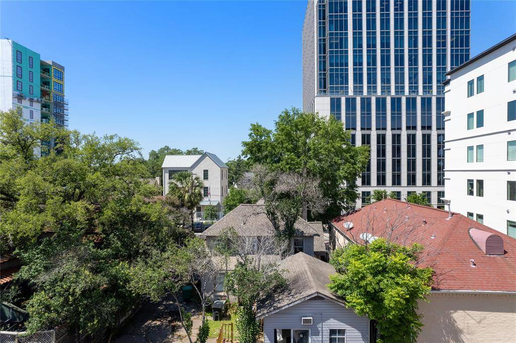 Northern-facing terrace captures tree-top views.