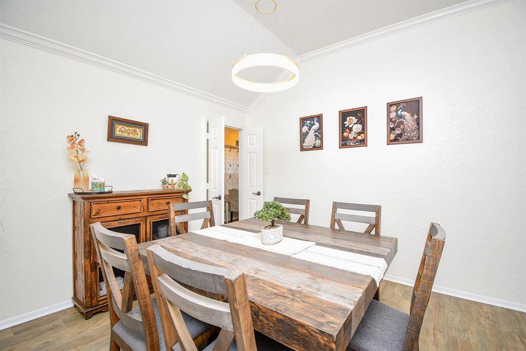 This dining room is bright and inviting, ideal for gatherings.