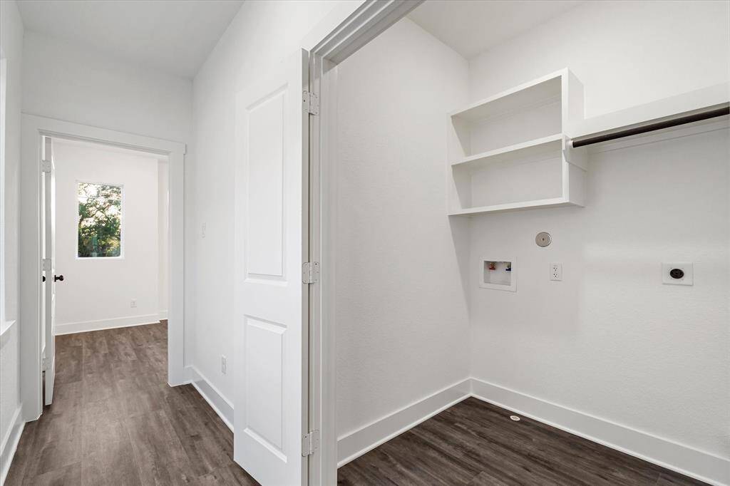 Spacious walk-in closet with plenty of shelving and hanging space!