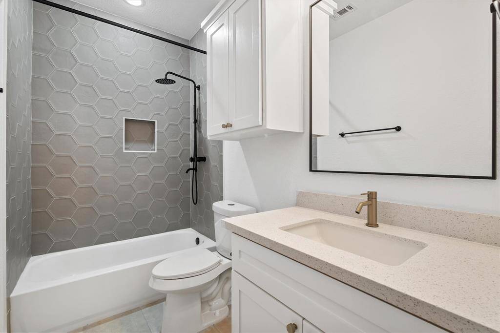 Upstairs laundry room with washer/dryer connections and shelving. Did I mention no carpet anywhere in the home!?