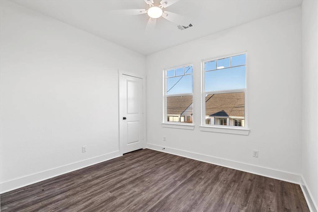 Bedroom two with walk-in closet & ceiling fan!