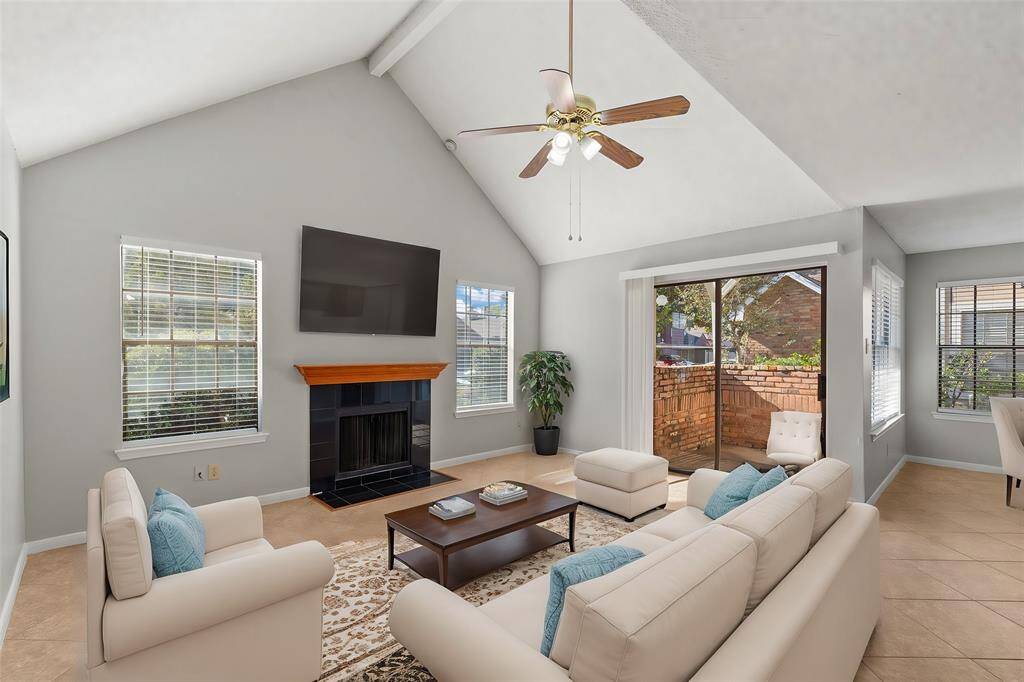 An open concept floorplan, terrific tile flooring and natural lighting from the oversized windows greet you upon entry into this Luxurious Living Room! (Virtually Staged)