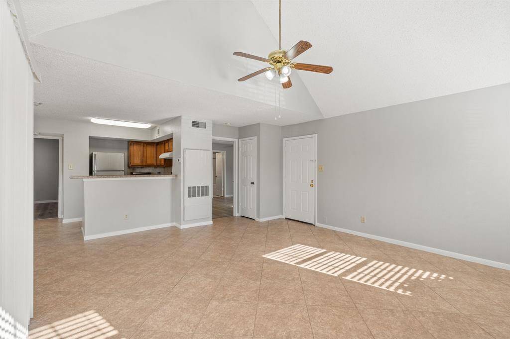 The Luxurious Living Room offers SOARING ceilings, breathtaking view of the serene community, and convenient access to the Gourmet Kitchen and Dedicated Dining Area. Perfect for hosting guests and large gatherings!