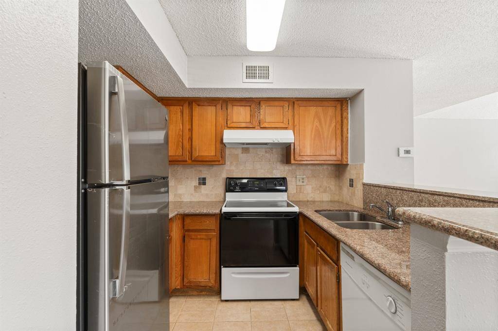 Welcome to the Gourmet Kitchen! The warm cabinetry, abundance of storage, breakfast bar for additional seating and Stainless Steel appliances are just a few of the highlights.