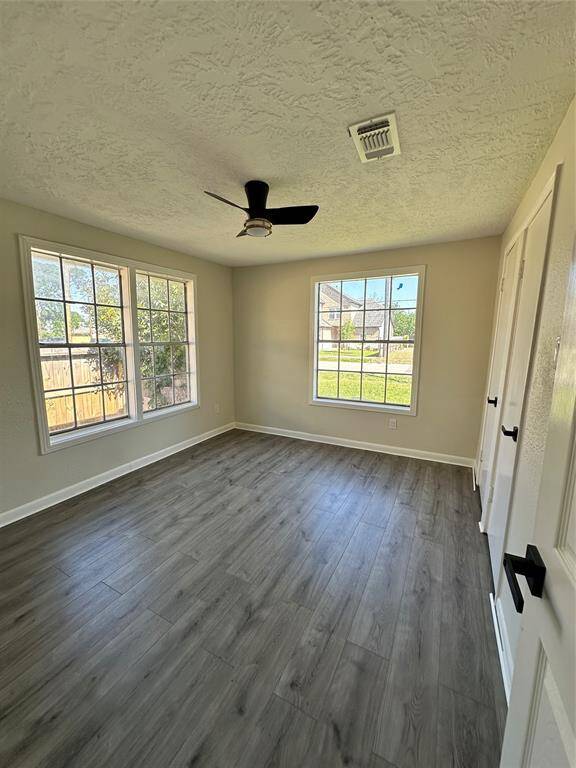 Spacious front bedroom featuring dual closets for ample storage.