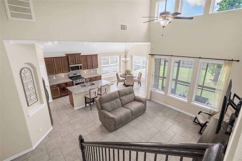 View from the staircase into the living room and kitchen.