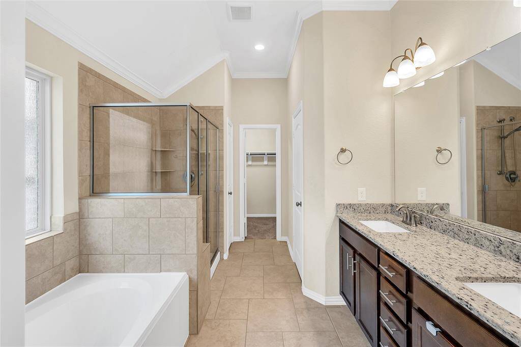 Large soaker tub with a separate shower.