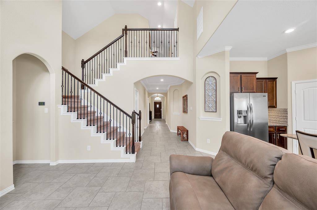 Open wrought iron staircase to the upstairs.