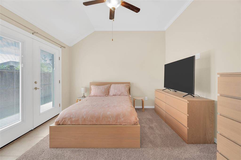 Next Gen suite features a spacious bedroom with French doors to the back side yard.
