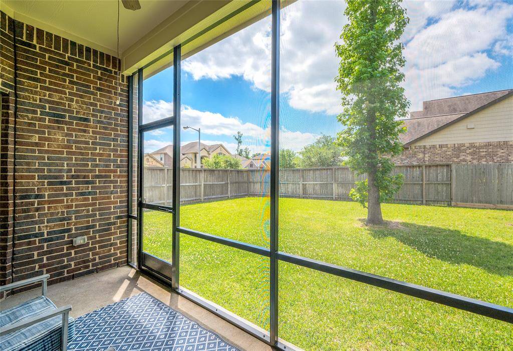 Full view of the backyard from the screened in porch.