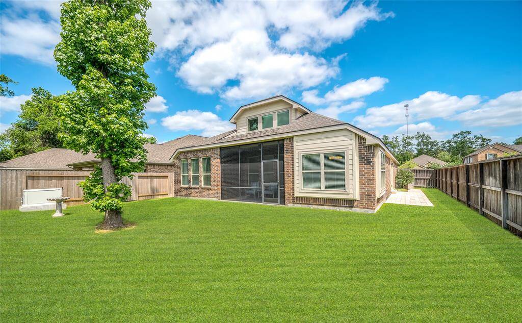 Full back view of the home with side entrance to the Next Gen suite.