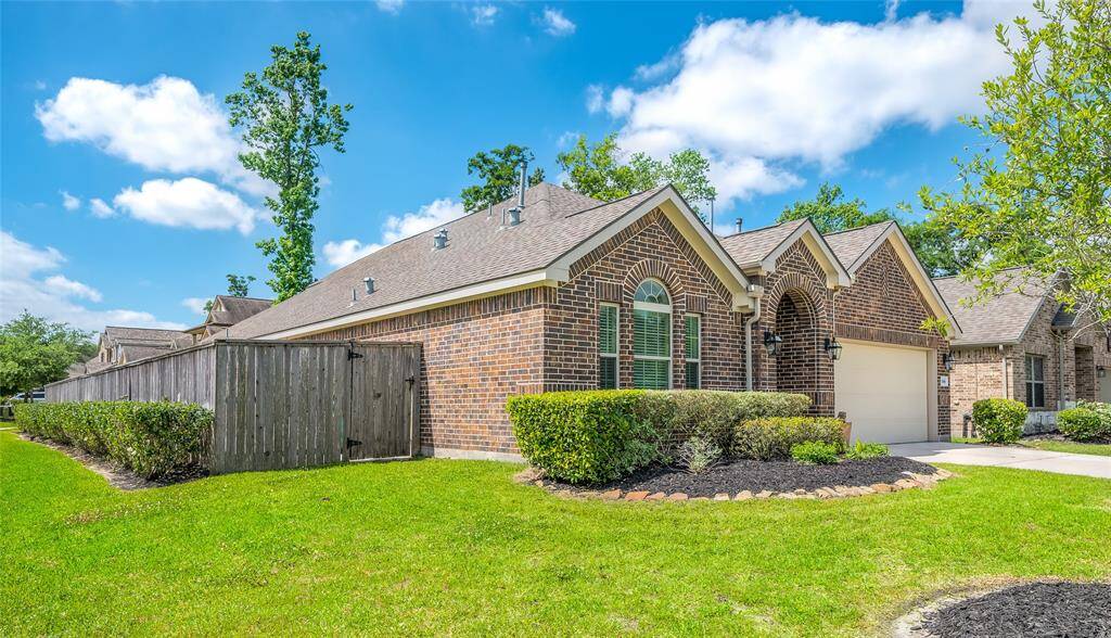Front side and garage view. Large corner lot for extra privacy.