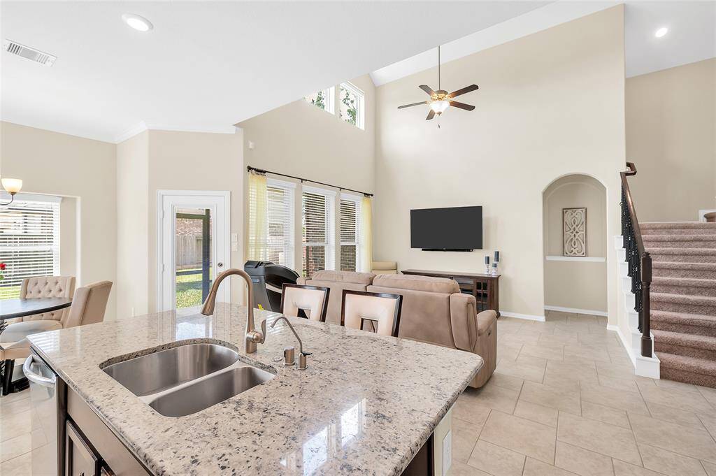 The kitchen flows seamlessly into the living room.