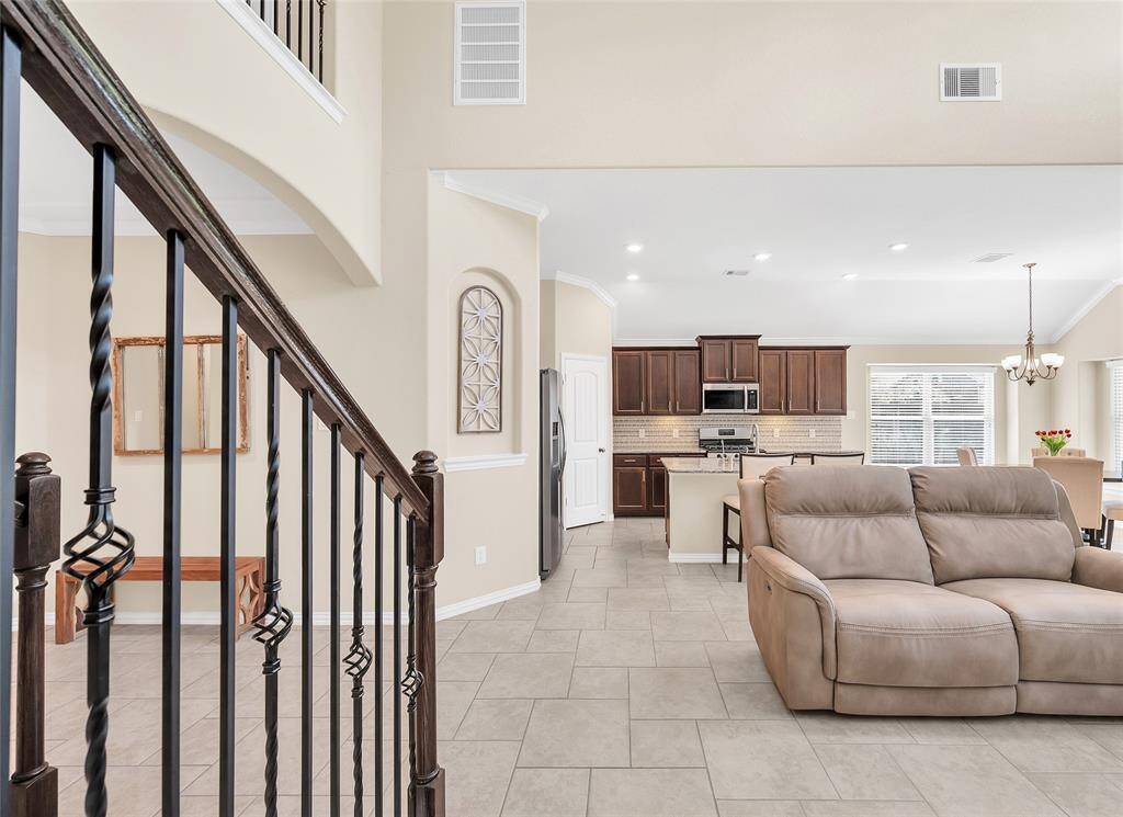 Open wrought iron staircase to the upstairs.