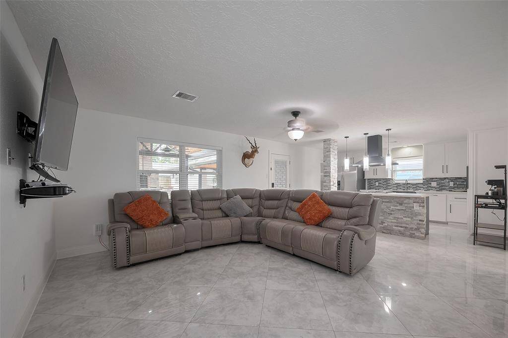 The spacious living room that opens up to the kitchen is perfect for entertaining!