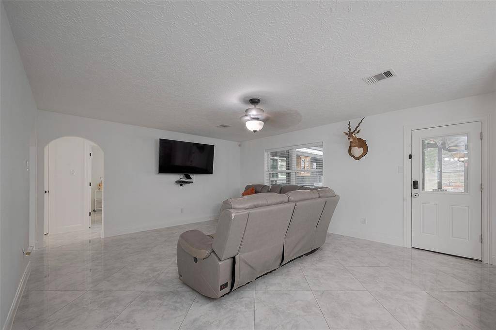 The generously sized living room allows for flexible furniture options