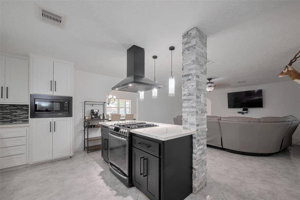 Fall in love with this kitchen that opens up to the family room