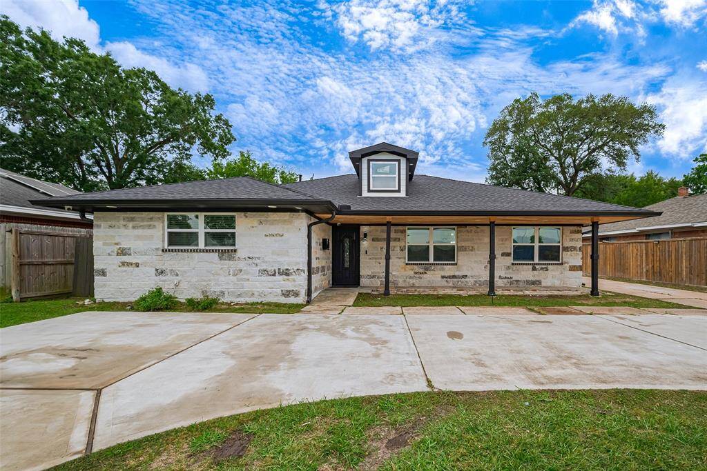 Front elevation upgrades include stone around the entire home, horseshoe driveway, covered front porch and gutters