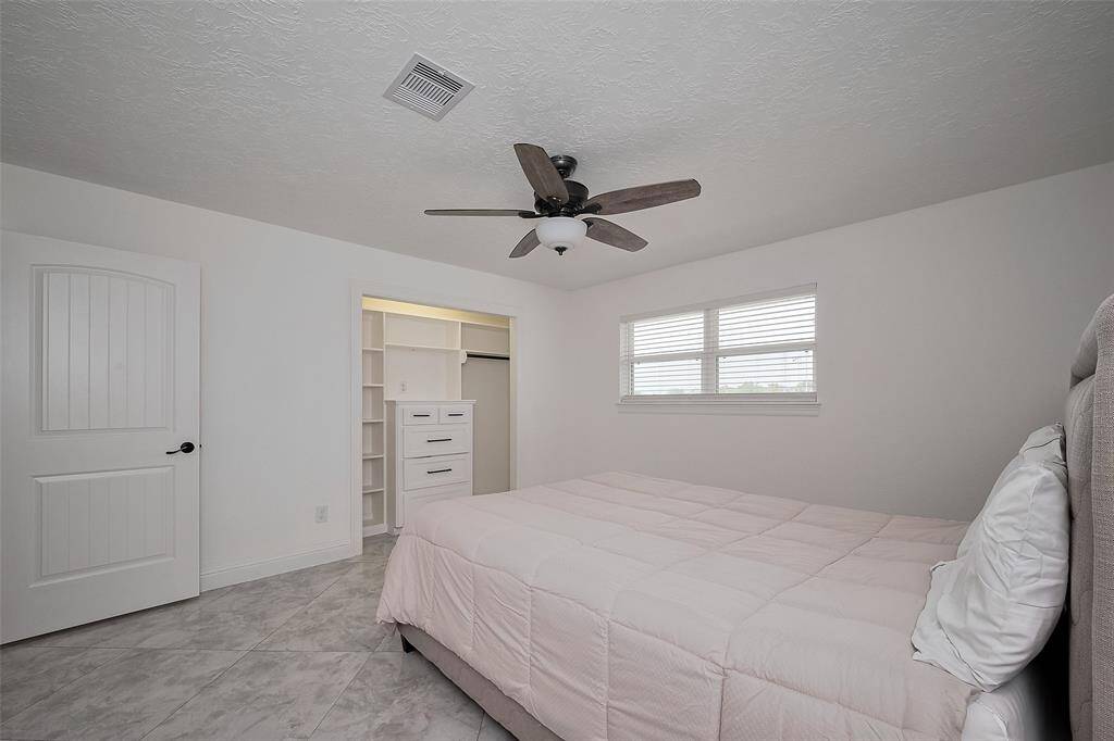 Guest bedroom located at the front of the home