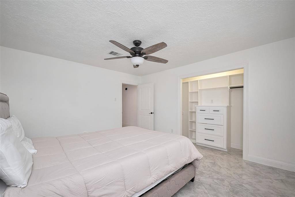 The renovations provide the perfect blend of taste and functionality. The closets in the guest bedroom come equipped with built-in dressers and shelving for extra storage