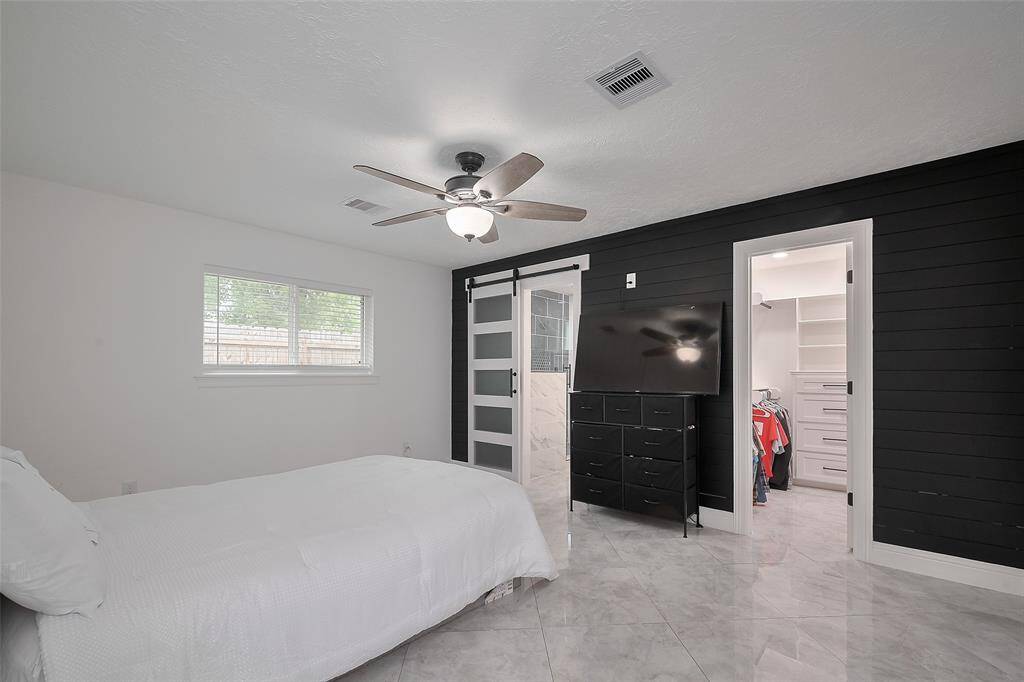 The spacious walk-in closet has built-ins for extra storage as well!