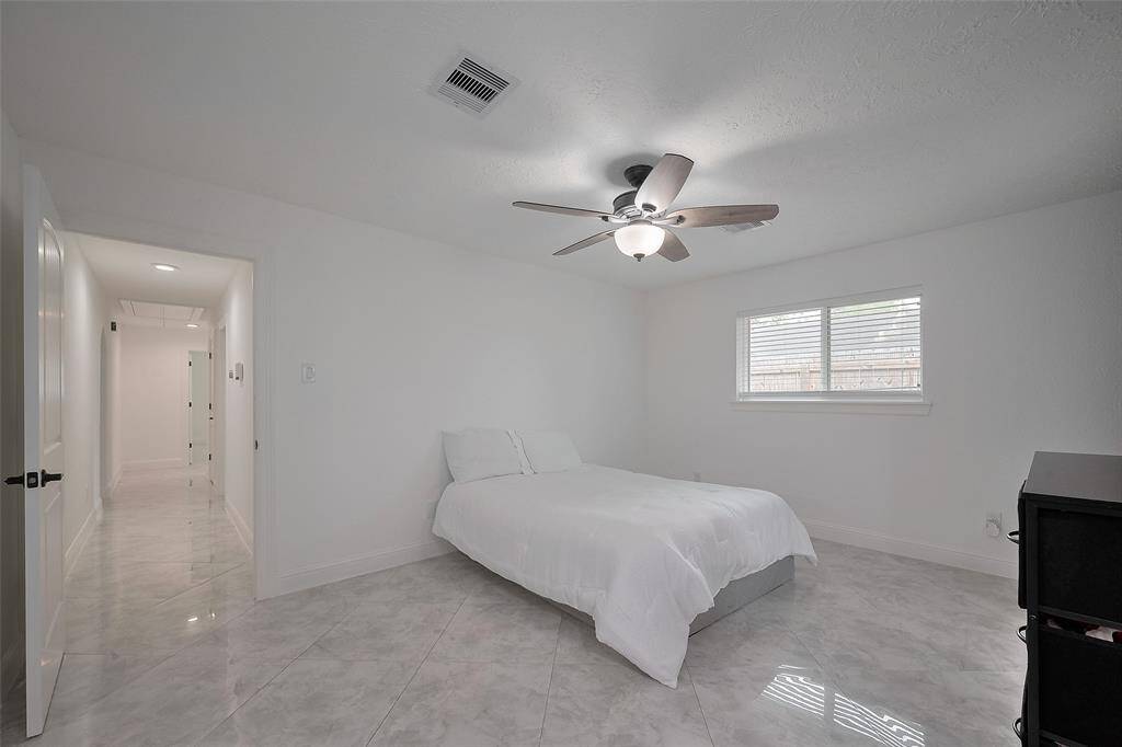The primary bedroom is located at the back left of the home
