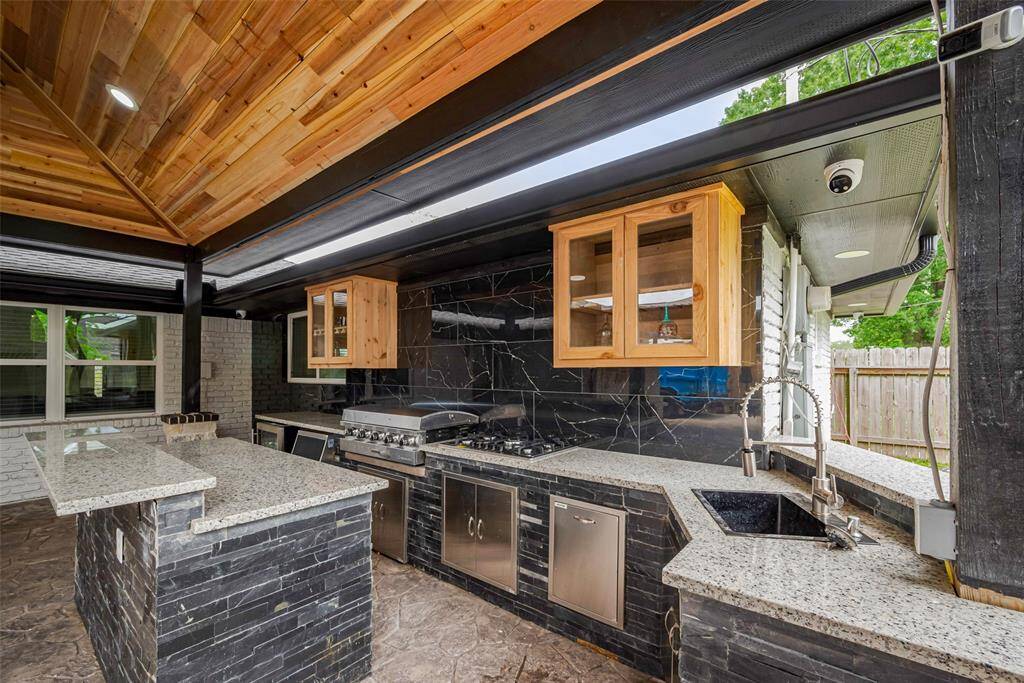 The custom wood shaker style cabinetry adds a sense of elegance