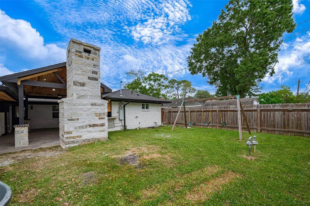 Back yard featuring the brick pizza oven