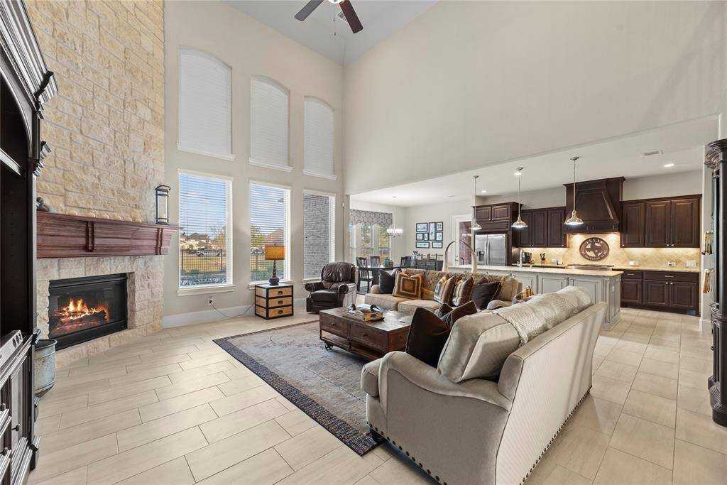 The living room, adjacent to the kitchen and breakfast area, offers a comfortable and inviting space for relaxation and socializing.