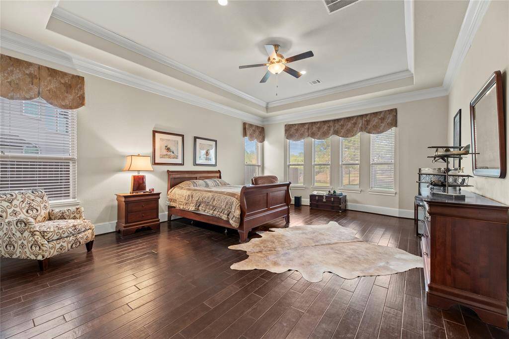 How perfect is this primary suite? Spacious and filled with natural light, this serene retreat offers the ultimate escape, promising comfort, tranquility, and pure relaxation.