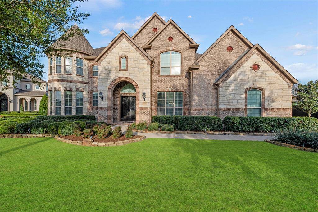 Welcome home to 2410 Legends Way, nestled in the prestigious Cane Island community in Katy!