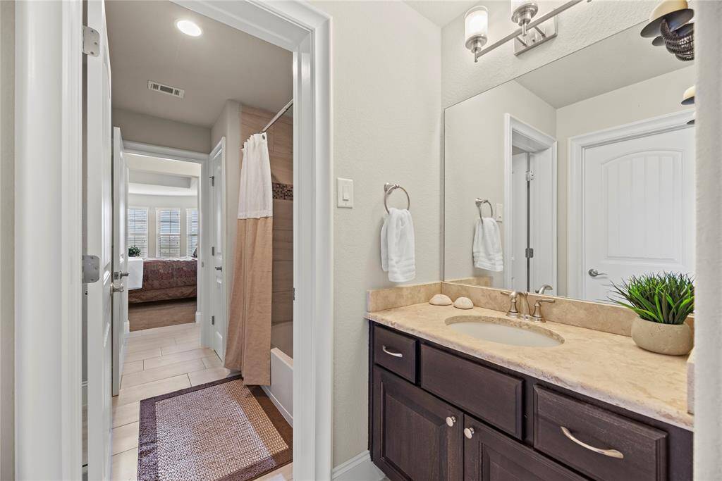 Thoughtfully designed with elegant finishes, this bathroom is perfect for sharing while still providing personal space—ideal for busy mornings or guest accommodations.