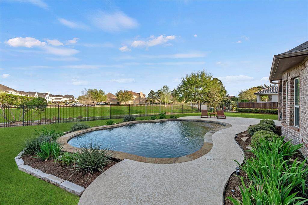 Experience unmatched convenience and privacy with no rear neighbors, plus direct access through your private back gate to peaceful walking trails surrounded by lush, scenic landscapes.